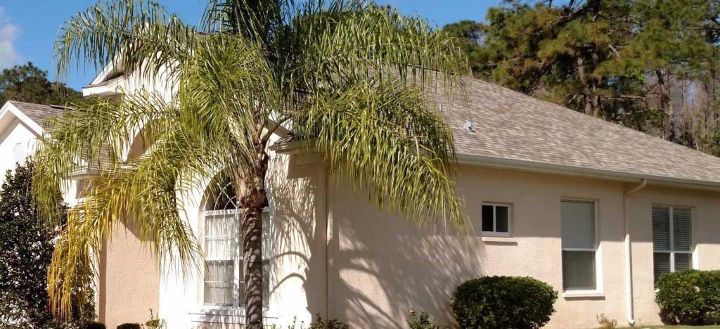 asphalt shingle roof replacement on a stucco home in central Florida