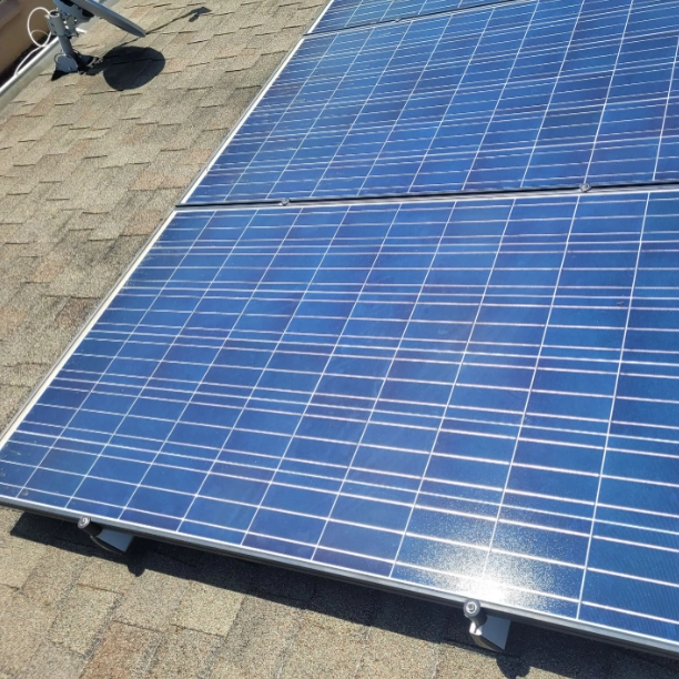 solar panels installed on a residential roof in Central Florida installed by the local roofing company; Alan's Roofing.