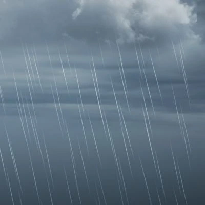 Close-up view of heavy rain falling from storm clouds, illustrating challenging conditions during a roof replacement in rainy weather.